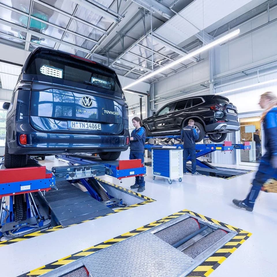 Mechanic inspecting car